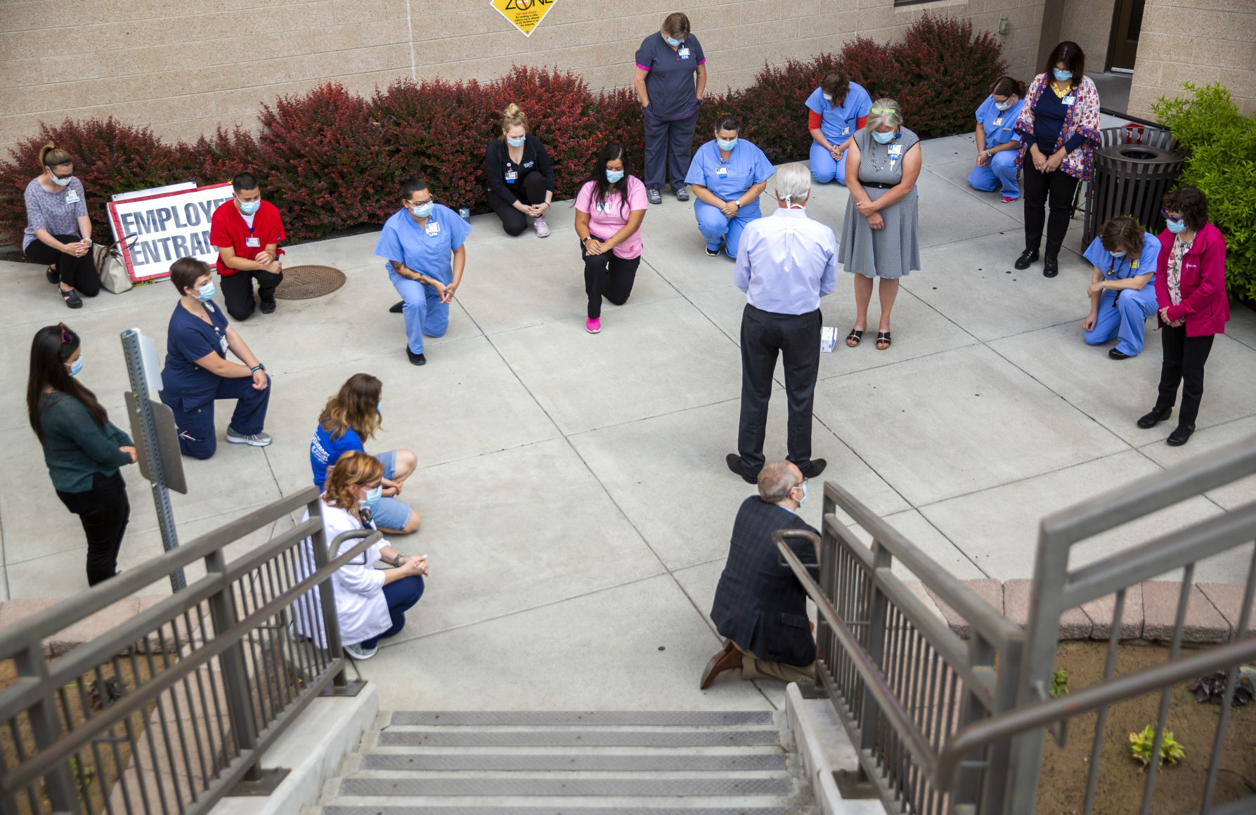 Hospital staff show solidarity with moment of silence